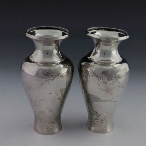 2 - A pair of Japanese silver vases, Meiji, inverse baluster form, each engraved with prunus branches an... 