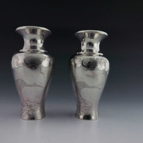 2 - A pair of Japanese silver vases, Meiji, inverse baluster form, each engraved with prunus branches an... 