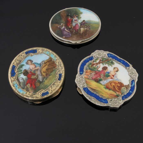 27 - Two Continental silver gilt powder compacts, each with printed enamelled covers depicting courtly co... 