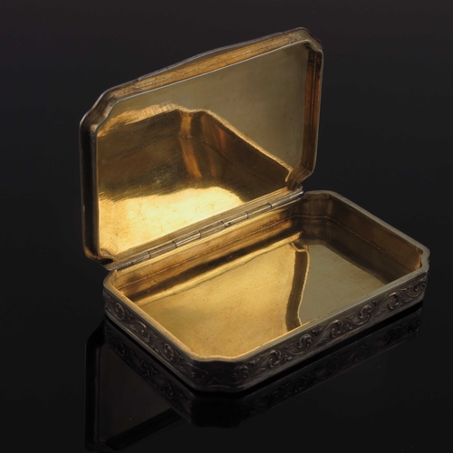 28 - An Austrian silver gilt and champleve enamelled snuff box, Vienna circa 1900, canted rectangular for... 