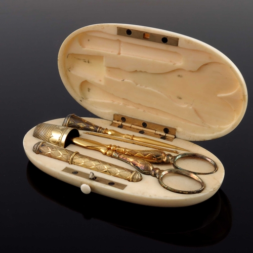 32 - A 19th century French silver gilt and ivory cased sewing set, the oval box fitted with scissors, thi... 