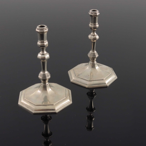 38 - A pair of Elizabeth II cast silver taper sticks, Wakely and Wheeler, London 1967, octagonal section ... 