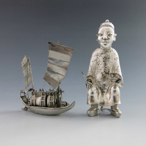 4 - A novelty Chinese white metal condiment, early 20th Century, in the form of a seated Mandarin, 12cm ... 