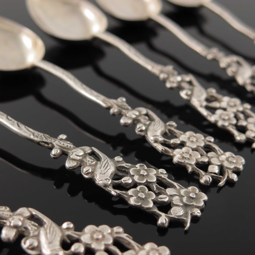 5 - A set of six Chinese export silver teaspoons, circa 1900, each cast with a pierced finial of bird in... 