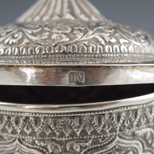 7 - An Indian Kutch silver box and cover, or tea caddy, 19th century, rounded bowl form, repousse emboss... 