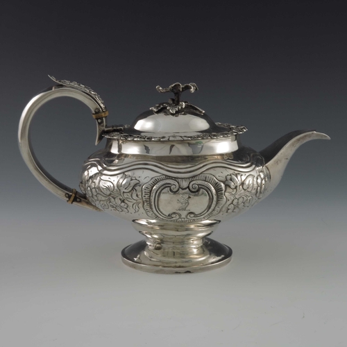 53 - A George IV silver three piece tea set, William Hunter, London 1826, footed ogee ovoid form, embosse... 