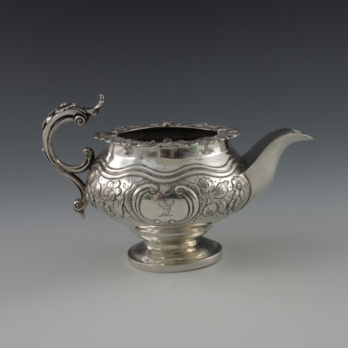 53 - A George IV silver three piece tea set, William Hunter, London 1826, footed ogee ovoid form, embosse... 