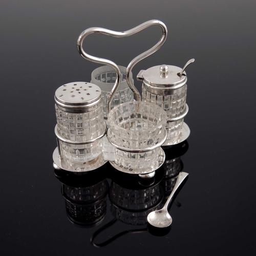 58 - An Edwardian silver and cut glass four piece cruet, Joseph Gloster Ltd., Birmingham 1909 and 1910, t... 