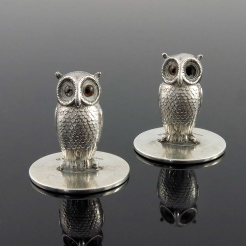 68 - A pair of George V novelty silver menu holders, Sampson Mordan, London 1932, modelled as owls, set w... 