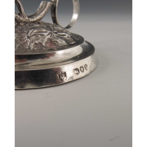 69 - A Victorian silver chamberstick, James Deakin and Son, London 1890, naturalistically modelled as a r... 