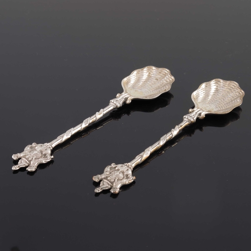 77 - A pair of Edwardian silver commemorative spoons, Carrington and Co., London 1905, cast shell bowls a... 