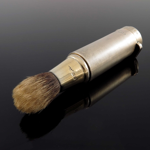 79 - A George V silver gilt travelling shaving brush, Finnigans Ltd., London 1919, engine turned tubular ... 