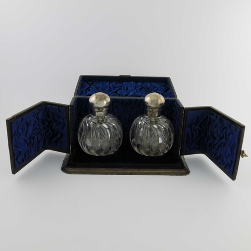 95 - A pair of Victorian silver mounted cut glass atomiser scent bottles, George Brace, London 1892, the ... 