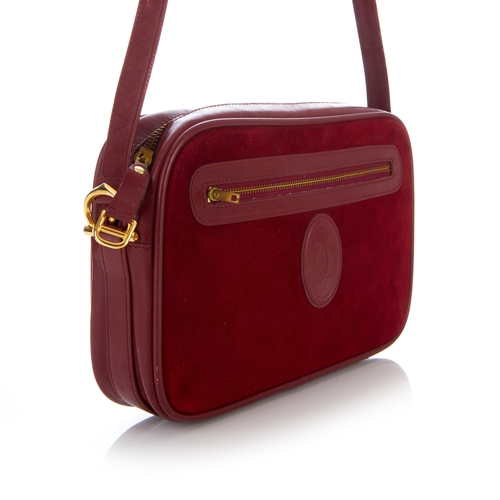 27 - Cartier, a vintage Bordeaux camera bag, crafted from burgundy suede with smooth burgundy leather tri... 