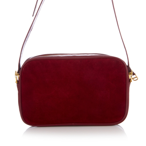 27 - Cartier, a vintage Bordeaux camera bag, crafted from burgundy suede with smooth burgundy leather tri... 