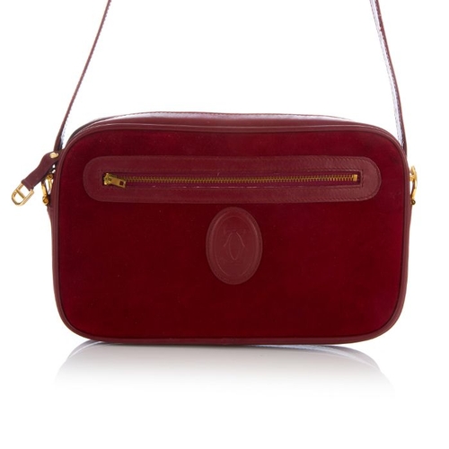 27 - Cartier, a vintage Bordeaux camera bag, crafted from burgundy suede with smooth burgundy leather tri... 