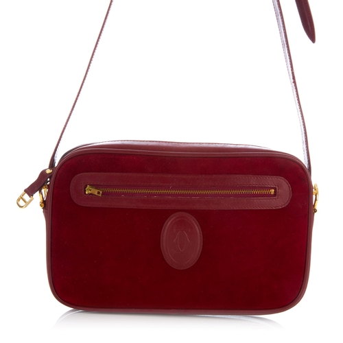 27 - Cartier, a vintage Bordeaux camera bag, crafted from burgundy suede with smooth burgundy leather tri... 