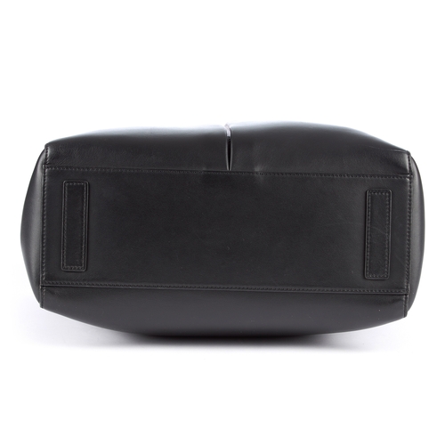 4 - Anya Hindmarch, a Nevis handbag, crafted from smooth black calf leather, featuring two large front o... 