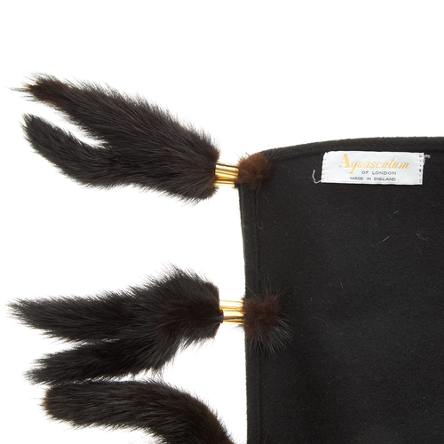 7 - Aquascutum, a black wool shawl, featuring mink fur tassels at either end, measuring 38 by 187cm