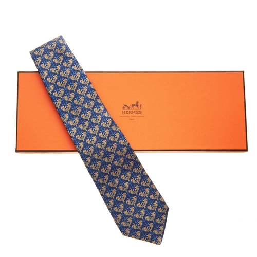 183 - Hermes, a silk tie, featuring a blue and yellow design, with maker's label, no. 7255 and box