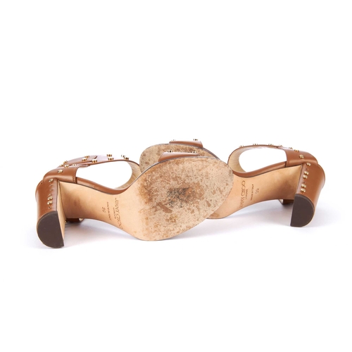 190 - Jimmy Choo, a pair of Veto studded heeled sandals, crafted from tan leather with gold-tone stud embe... 