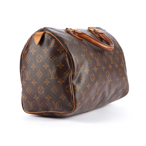 202 - Louis Vuitton, a monogram Speedy 30 handbag, designed with the maker's monogram coated canvas exteri... 