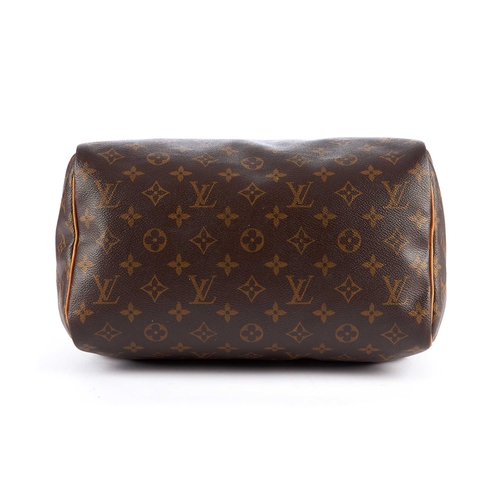 202 - Louis Vuitton, a monogram Speedy 30 handbag, designed with the maker's monogram coated canvas exteri... 