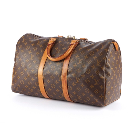 206 - Louis Vuitton, a monogram Keepall 45 luggage bag, designed with vachetta natural leather trim, rolle... 