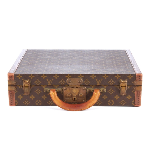 209 - Louis Vuitton, a monogram President Classeur briefcase, featuring logo stamped leather trim, brass f... 