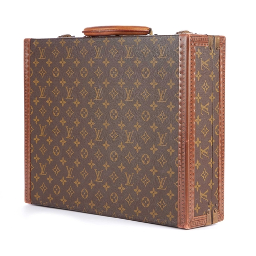209 - Louis Vuitton, a monogram President Classeur briefcase, featuring logo stamped leather trim, brass f... 