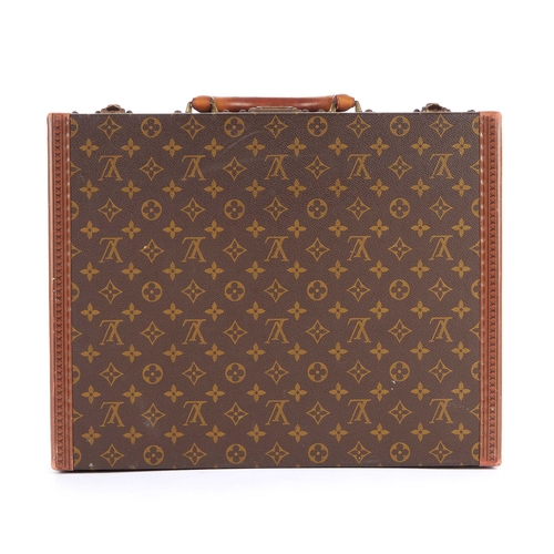 209 - Louis Vuitton, a monogram President Classeur briefcase, featuring logo stamped leather trim, brass f... 