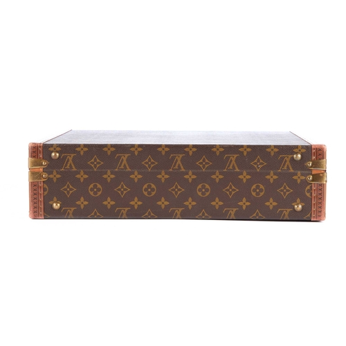 209 - Louis Vuitton, a monogram President Classeur briefcase, featuring logo stamped leather trim, brass f... 