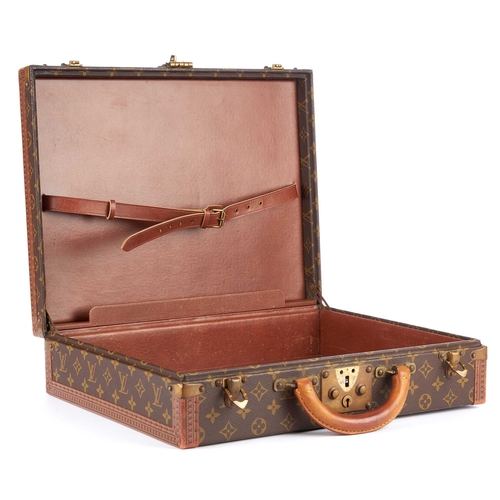 209 - Louis Vuitton, a monogram President Classeur briefcase, featuring logo stamped leather trim, brass f... 