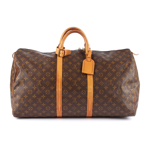 212 - Louis Vuitton, a monogram Keepall 55 luggage bag, featuring the maker's classic monogram coated canv... 