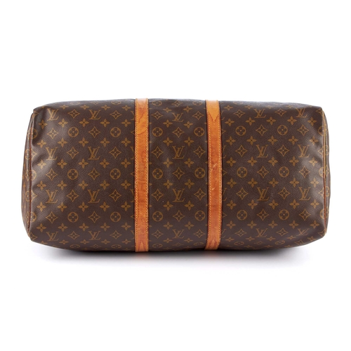 212 - Louis Vuitton, a monogram Keepall 55 luggage bag, featuring the maker's classic monogram coated canv... 