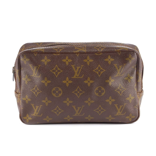 221 - Louis Vuitton, a monogram Toiletry PM pouch, featuring a top zip fastening and washable beige interi... 