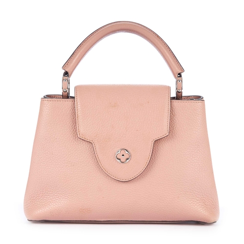 229 - Louis Vuitton, a Capucines BB handbag, crafted from dusty pink taurillon leather with contrasting bl... 