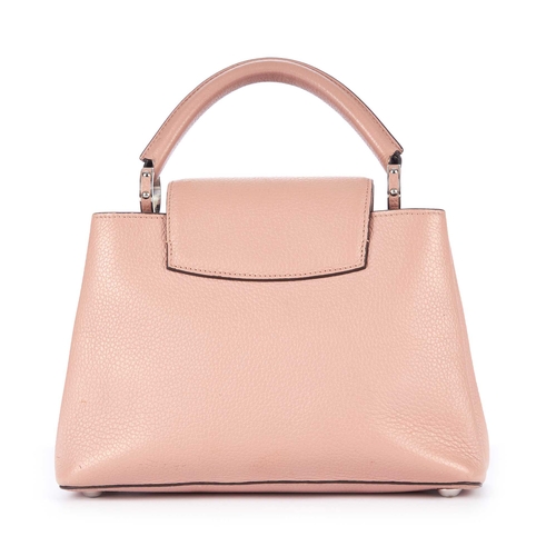 229 - Louis Vuitton, a Capucines BB handbag, crafted from dusty pink taurillon leather with contrasting bl... 