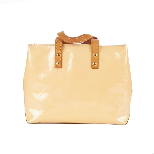 231 - Louis Vuitton, a monogram vernis Reade PM handbag, featuring a cream monogram embossed patent leathe... 