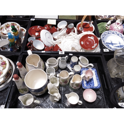 66 - A Noritake tea service, decorated with flowers on a deep rust ground, comprising teapot, teacups and... 