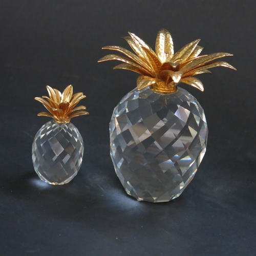 161 - Two Swarovski crystal and gilt metal pineapples.  (2)