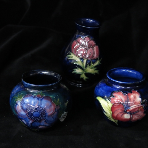 171 - Walter Moorcroft, three small vases, including hibiscus, anemone, shouldered and baluster forms, imp... 