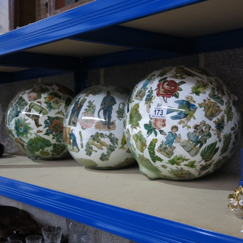 173 - Three Victorian reverse pasted scrap print large glass baubles, each with various cuttings including... 