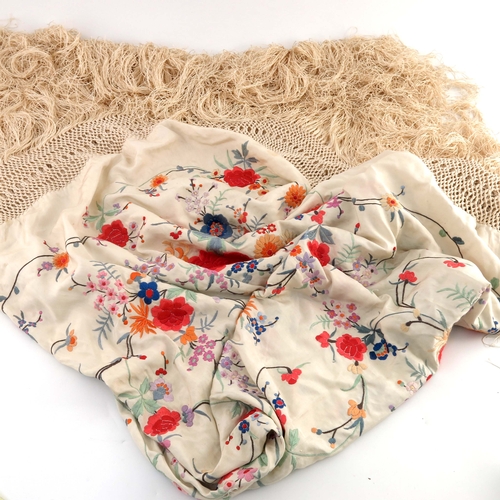 91 - A Silk fringed piano shawl with silk embroidered flowers and leaves, ivory ground