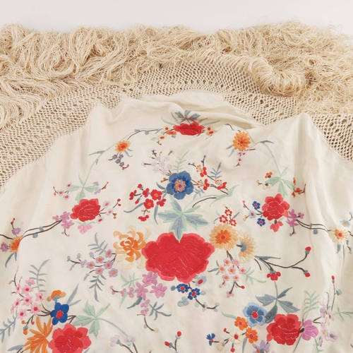 91 - A Silk fringed piano shawl with silk embroidered flowers and leaves, ivory ground