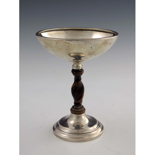 131 - A George V silver and oak tazza, Charles Perry and Co., Birmingham 1925, in the Arts and Crafts styl... 