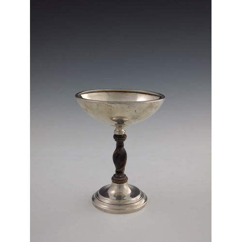 131 - A George V silver and oak tazza, Charles Perry and Co., Birmingham 1925, in the Arts and Crafts styl... 