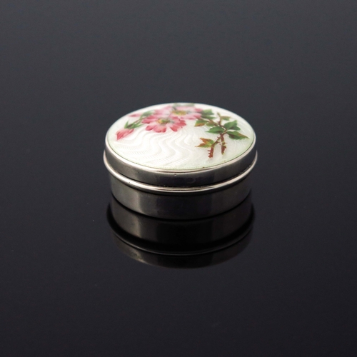 133 - An Edwardian silver and enamelled pill box, Birmingham 1906, circular, with cream guilloche enamel a... 