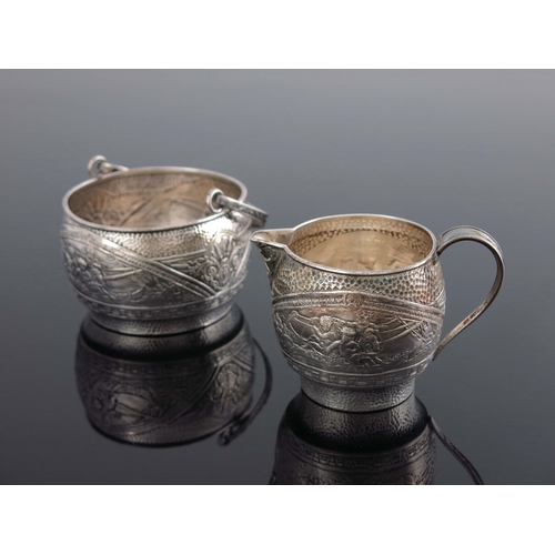 138 - An American Aesthetic Movement silver jug and bowl, Gorham, RI 1880, ogee form, planished and emboss... 