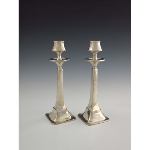 149 - A pair of Arts and Crafts silver candlesticks, W G Sothers Ltd., Birmingham 1923, square section spl... 